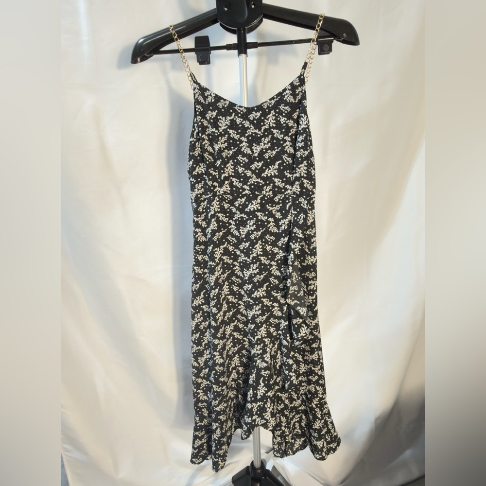 Chic Black Ruffle Dress with White Floral Design